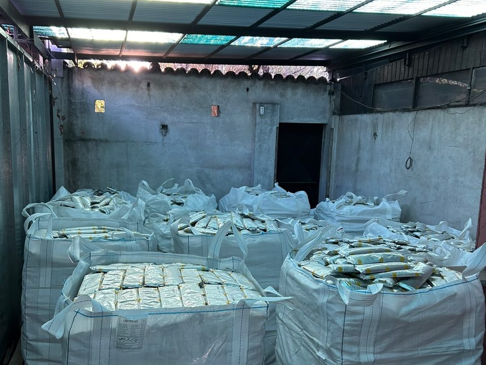 Bulk bags of lithium battery cells on pallets, stored in a warehouse