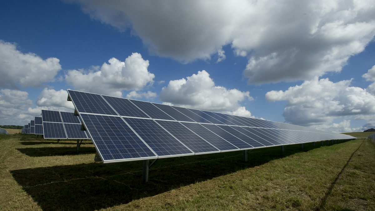Rows of photovoltaic modules at an open-air solar plant